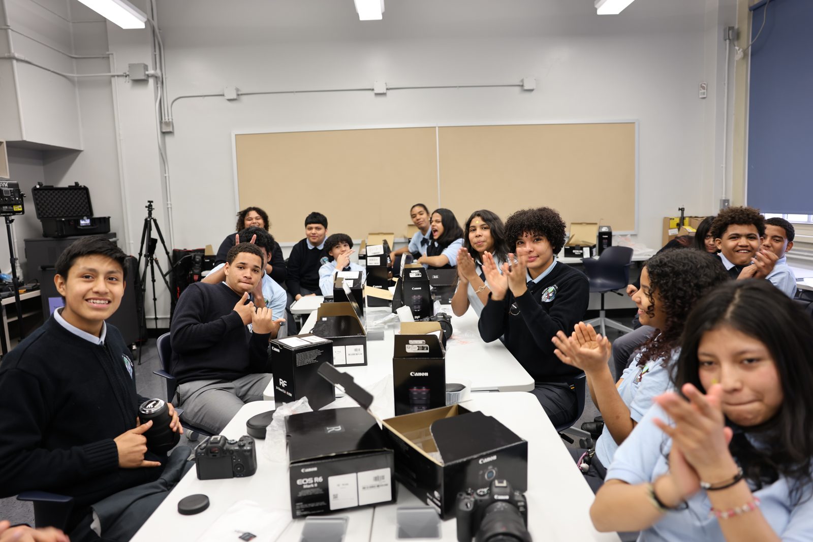 Students with new camera gear in their school media program